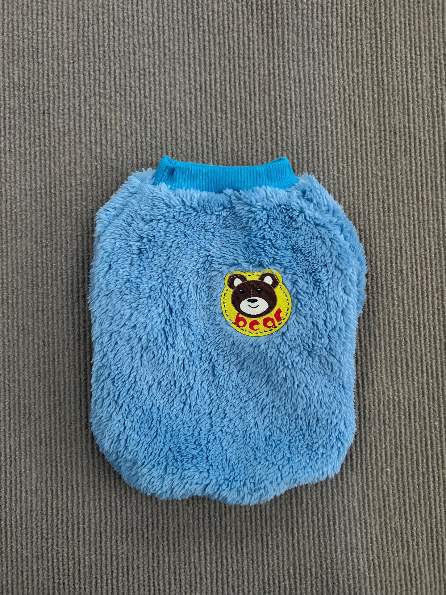 ABRIGO DE PELUCHE CELESTE